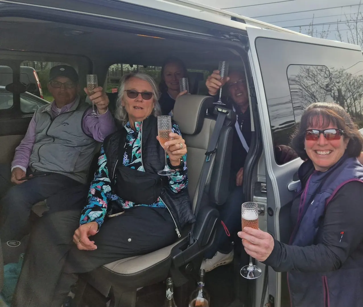 A group of adult passengers enjoying a journey in a B-Direct minibus